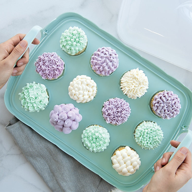 Nordic Ware | Cakes and Cupcakes Carrier showcasing cupcakes with frosted tops on a tray, highlighting its versatile design for transporting baked goods.