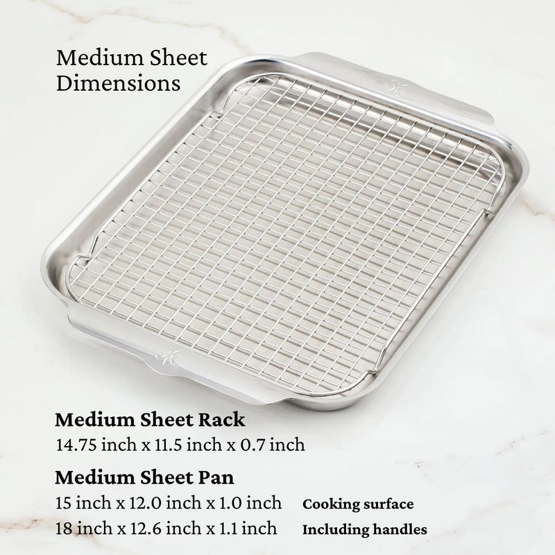 Hestan Provisions OvenBond Tri-Ply Bakeware Medium Sheet Pan with Rack, stainless steel, featuring wide handles and a wire rack, ideal for baking and roasting.