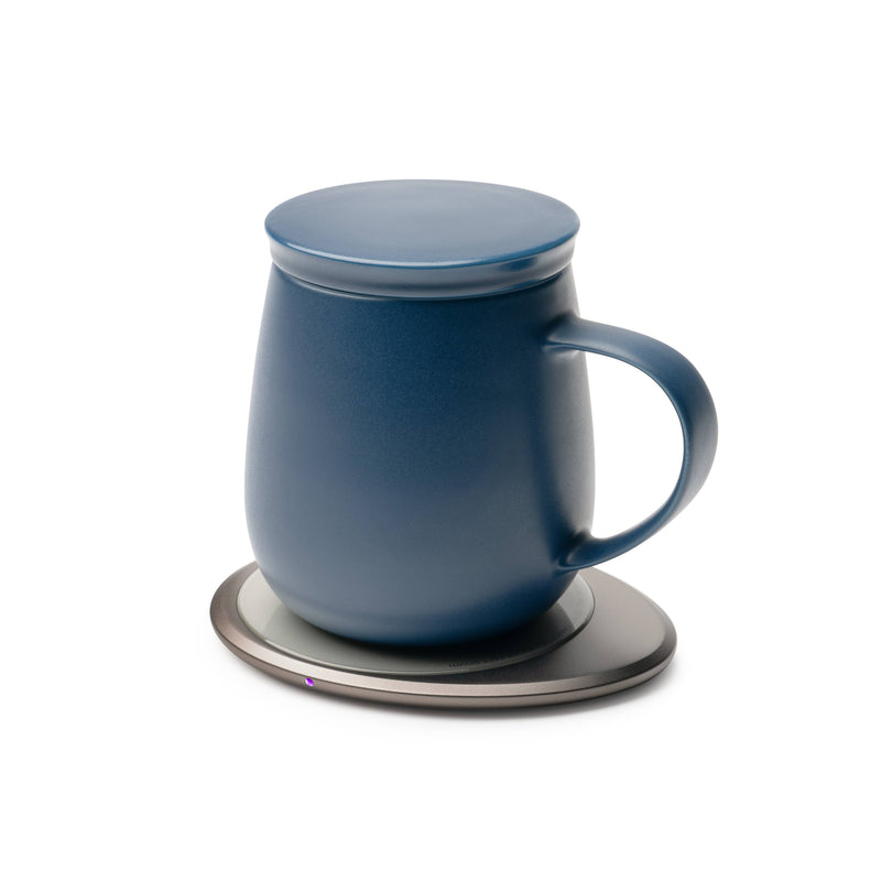 OHOM - Ui 3 Self-heating Mug Set: Jasmine White, featuring a blue ceramic mug with lid on a smart electronic coaster, ideal for keeping beverages warm and charging devices.