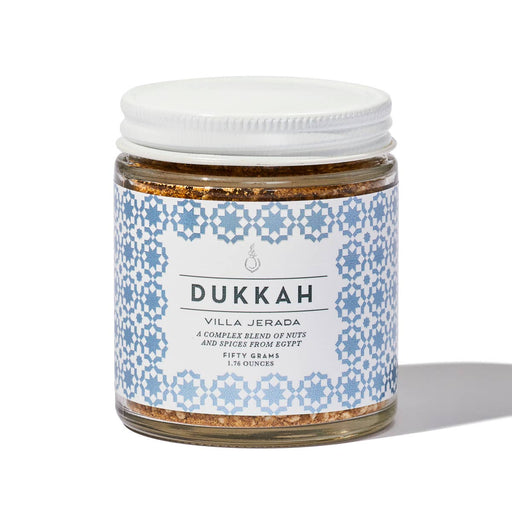 Villa Jerada - Dukkah - 50g: A small glass jar of Egyptian nut and spice blend, ideal for enhancing dips, meats, and traditional dishes.