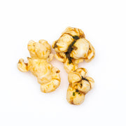 Poppy Hand-Crafted Popcorn - Mexican Street Corn Popcorn, showcasing a mound of popcorn, highlighting its texture and enticing flavor inspired by Mexican street food.