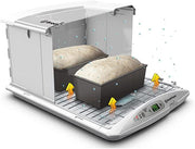 Brod & Taylor FP-125 Folding Proofer & Slow Cooker in use, featuring two loaves of bread baking inside, showcasing its versatile cooking capabilities.
