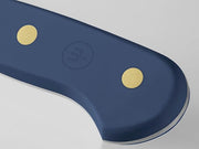 Wüsthof Classic 7 Hollow Edge Santoku knife, close-up view, showcasing its precision blade ideal for slicing and dicing, available at Athens Cooks.