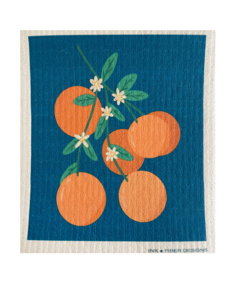 Swedish dishcloth featuring orange and floral embroidery, titled Ink and Fiber Designs - Orange Blossoms, ideal for eco-friendly cleaning, available at Athens Cooks kitchen store.