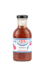 Beth's Farm Kitchen - Farm Ketchup - Low Sugar in a 12 oz glass bottle, showcasing its natural, local ingredients perfect for enhancing various dishes. Vegan and gluten-free.
