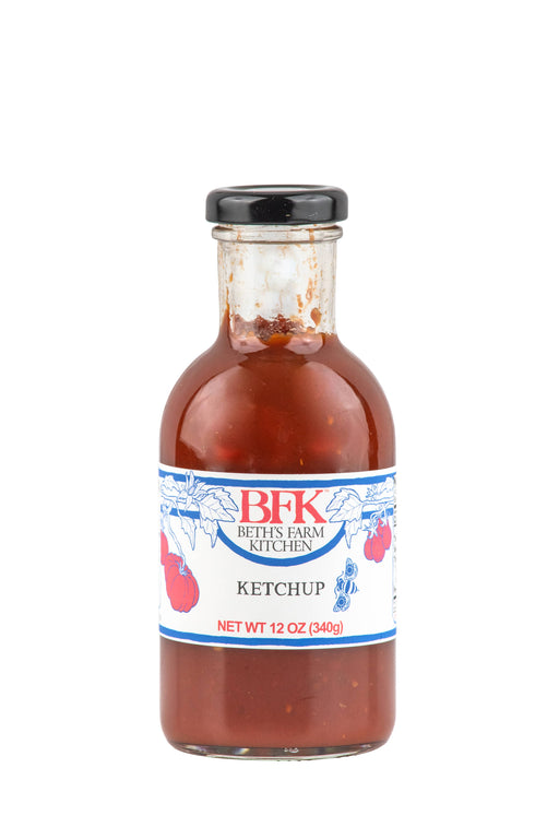 Beth's Farm Kitchen - Farm Ketchup - Low Sugar in a 12 oz glass bottle, showcasing its natural, local ingredients perfect for enhancing various dishes. Vegan and gluten-free.