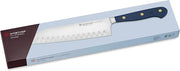 Wüsthof Classic 7 Hollow Edge Santoku Wild Blueberry knife with a black handle resting on a box, showcasing its precision blade design for versatile kitchen use.
