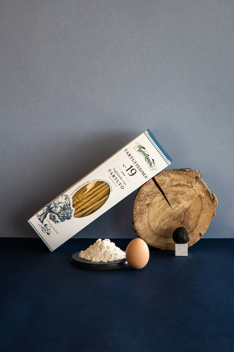TartufLanghe - Tartufissima® N°19 Truffle Pasta displayed with flour, egg, and truffle, highlighting its gourmet, artisanal quality and rich, aromatic flavor.