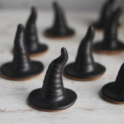 Gravesco Pottery - Black Witch Hat ring holder on light wood, showcasing its handmade ceramic design, perfect for Halloween decor or jewelry display.