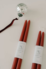Mo&Co Home - Berry Red Dipped Beeswax Taper Candles: Two 14-inch handcrafted candles, eco-friendly, 100% beeswax, with cotton wick, adorned with a silver ornament.