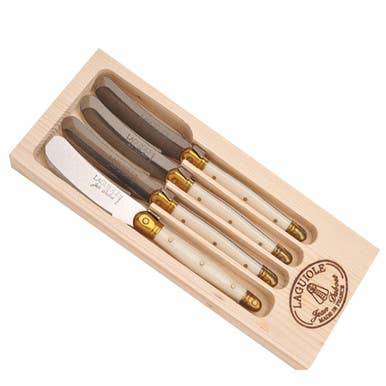 Jean Dubost | Set of 4 Ivory Spreaders.