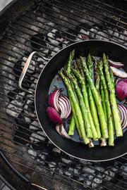 de Buyer | Outdoor Fry Pan - Long Handle, designed for BBQ enthusiasts, features blue carbon steel and a perforated design for grilling delicate foods without losing them through grates.