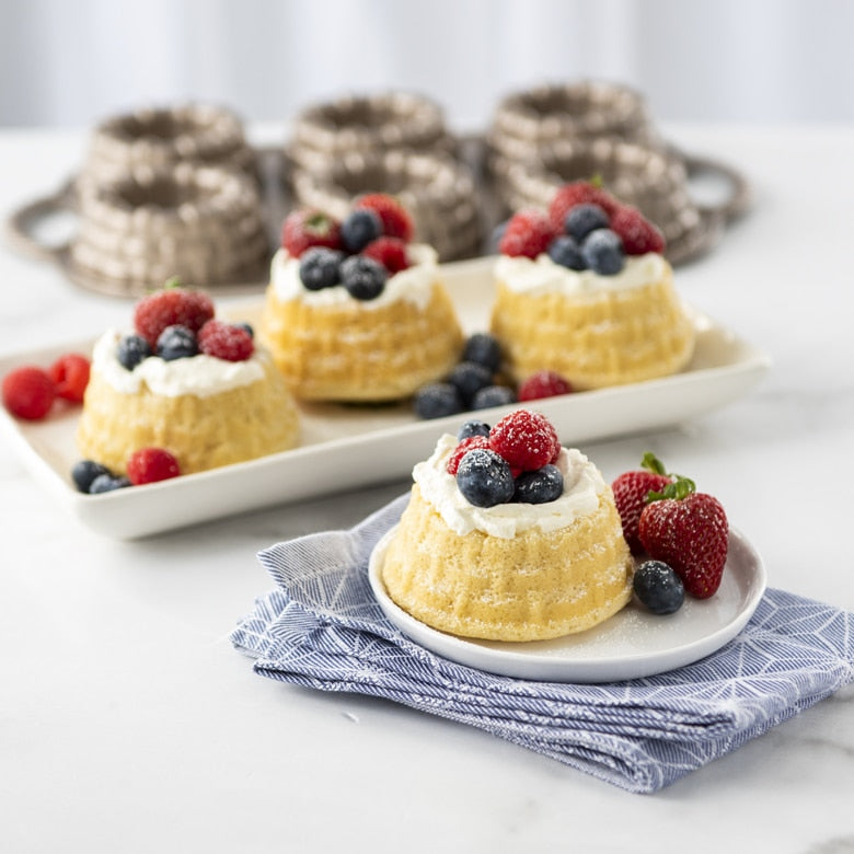 Nordic Ware | Shortcake Baskets Pan showcasing a beautifully detailed dessert topped with fresh berries, ideal for creating impressive shortcake or molded gelatin desserts.