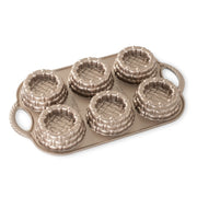 Nordic Ware | Shortcake Baskets Pan, featuring six detailed molds for creating 1/2-cup shortcakes or gelatin cups, ideal for unique desserts or salads.
