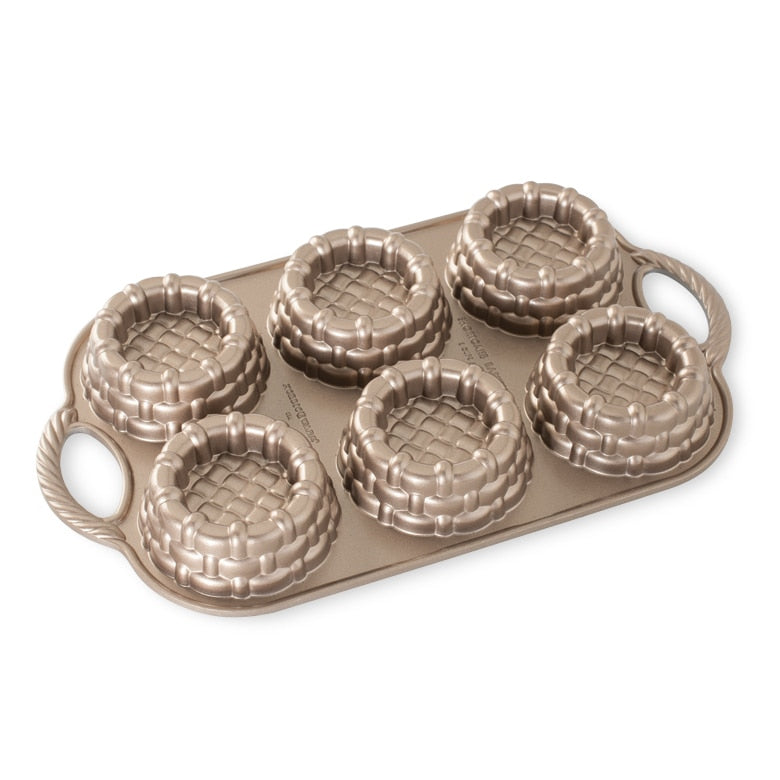 Nordic Ware | Shortcake Baskets Pan, featuring six detailed molds for creating 1/2-cup shortcakes or gelatin cups, ideal for unique desserts or salads.
