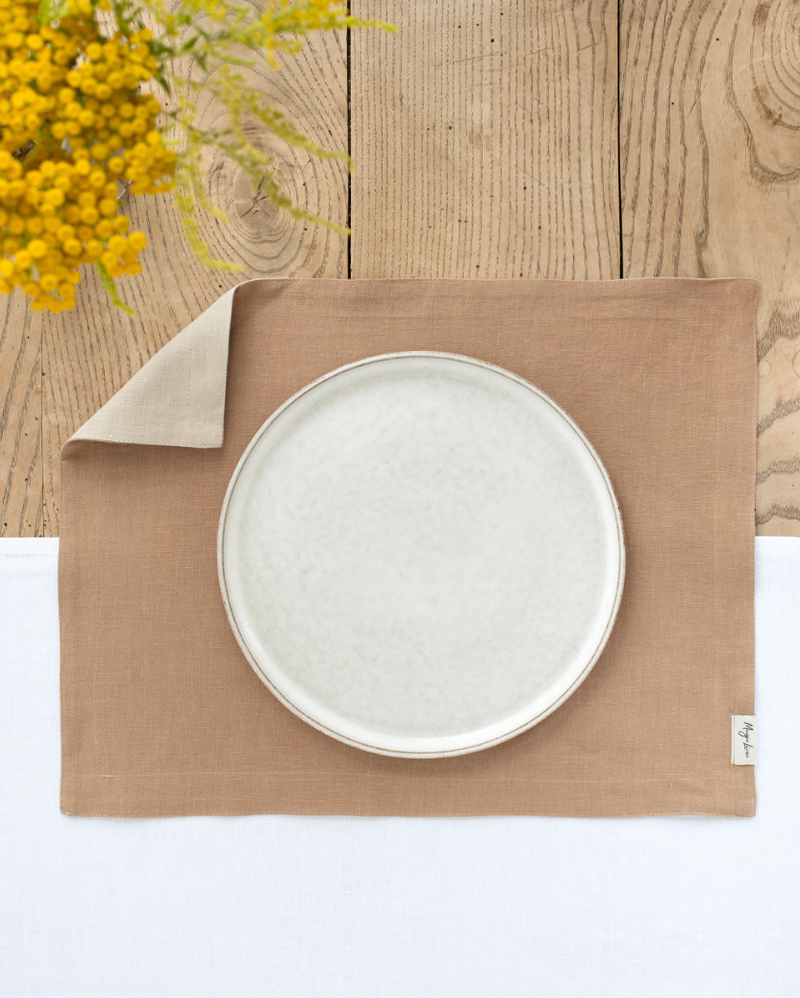 MagicLinen - Double Layer Linen Placemat Set of 2: Cinnamon, displayed with a white plate and fork on a table, enhancing dining elegance and protection.
