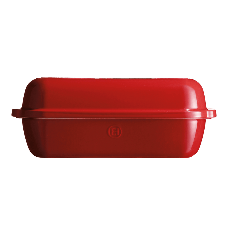 Emile Henry Loaf Bread Baker in Burgundy, featuring a lidded design for artisan-style baking with steam-trapping ceramic walls, ridged base, and easy-grip handles.