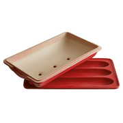 Emile Henry | Baguette Baker, Burgundy: Two-piece set with grooved tray and vented lid for baking three mini-baguettes, ensuring a crispy crust and easy dough release.