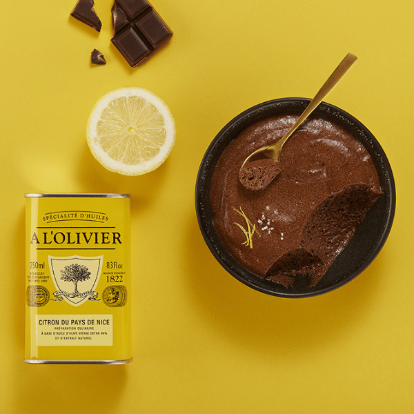 The French Farm - A l'Olivier Lemon From Nice Olive Oil 8.4oz tin with chocolate mousse, lemon, and dark chocolate, highlighting its gourmet versatility.