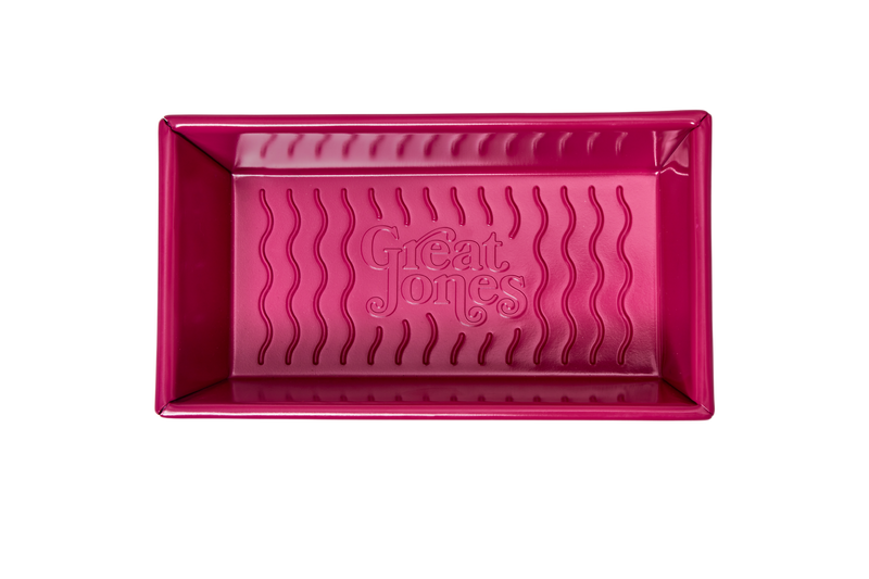 Great Jones | Breadwinner - Raspberry loaf pan features a nonstick, wavy bottom design for effortless baking, ideal for perfect banana bread every time.