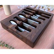 Loudblade - Custom Solid Walnut Wooden Flatware Drawer Organizer with slots for spoons and forks on a salmon tablecloth, featuring elegant walnut wood design.