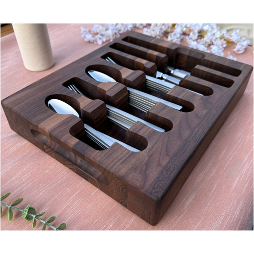 Loudblade - Custom Solid Walnut Wooden Flatware Drawer Organizer with slots for spoons and forks on a salmon tablecloth, featuring elegant walnut wood design.