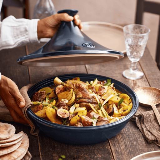 Emile Henry | Tagine, Ocean, reveals a savory stew of meat, potatoes, figs, and herbs, perfect for tender, flavorful cooking on stovetop or oven.