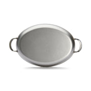 de Buyer | Oval Roasting Pan with handles, ideal for roasting meat or vegetables, enhancing any dining experience with its elegant presentation.