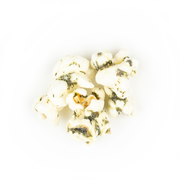 Poppy Hand-Crafted Popcorn - Dill Pickle Popcorn, featuring a pile of crunchy popcorn seasoned with white cheddar, vinegar, and dill, offering a tangy, savory snack experience.