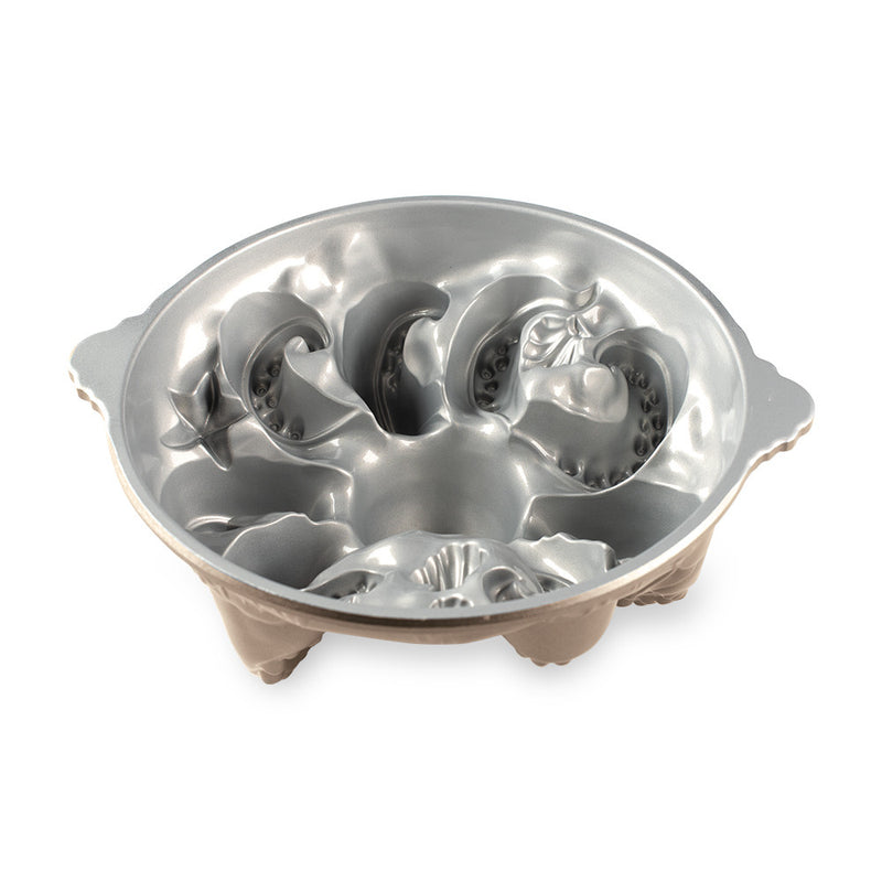 Nordic Ware Octopus Cake Pan, featuring intricate seashell and limb designs for beach-themed cakes. Made of cast aluminum with nonstick coating for easy release.