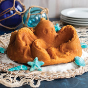 Nordic Ware | Octopus Cake Pan: Cast aluminum mold for creating detailed octopus-shaped cakes, featuring eight limbs and seashell accents, ideal for themed gatherings.