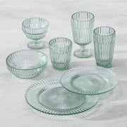 Fortessa Archie Verde 22.8oz Cereal Bowl displayed among a group of glass dishes, showcasing its elegant serveware design.