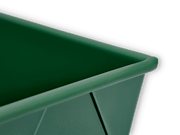 Great Jones | Breadwinner - Raspberry loaf pan with a unique wavy, corrugated bottom, designed for easy release and scratch resistance, featured against a black background.