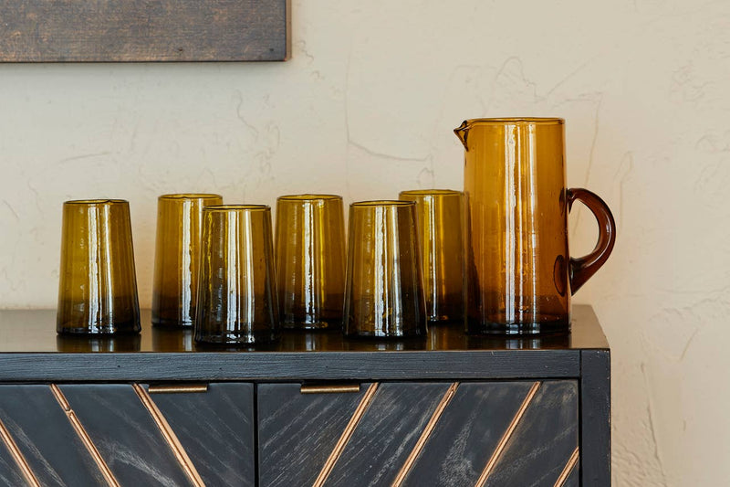 Set of six hand-blown Moroccan Cone Glassware, featuring a sleek design with visible suspended bubbles, made from recycled bottles, perfect as glasses or vases.