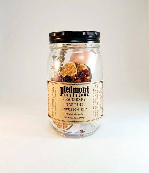 Piedmont Provisions Cranberry Martini Cocktail Infusion Kit in a glass jar with dried citrus, cranberries, and botanicals, ideal for homemade cranberry martinis.