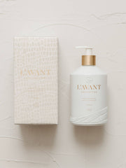 L'AVANT Collective Fresh Linen Dish Soap in a white bottle with gold lid, showcased alongside its packaging, emphasizing elegance and high performance for modern kitchens.