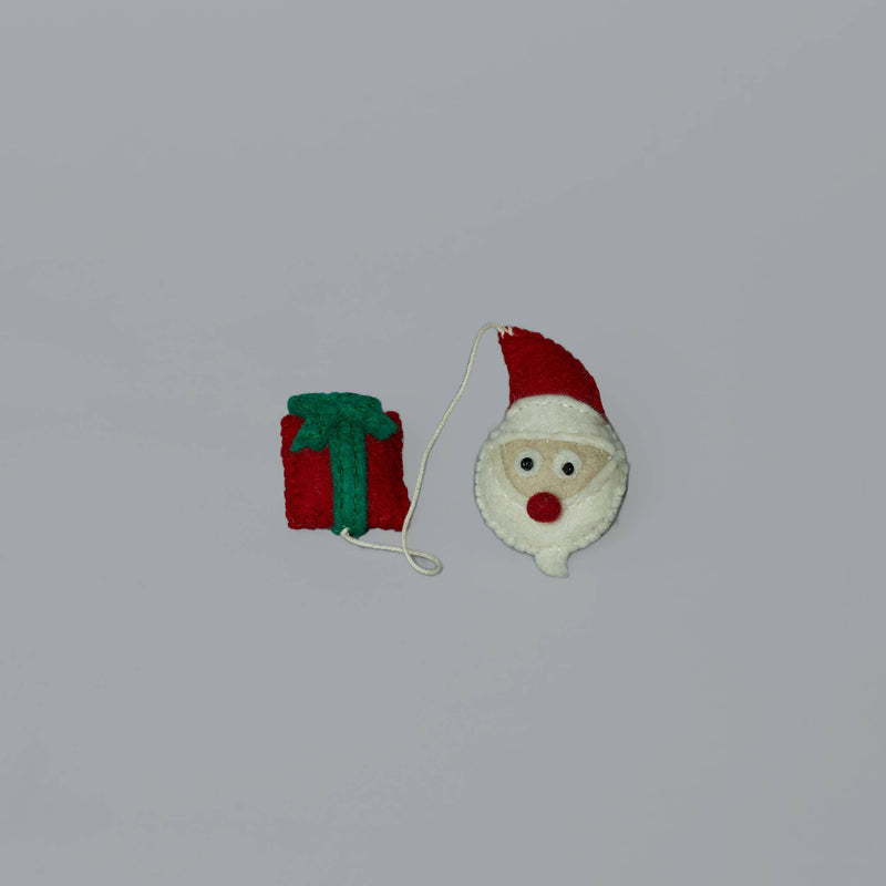 Ware of the Dog - Santa & Present Cat Toy: Handmade felt ornaments filled with catnip, featuring a Santa head and present, linked by a white string.