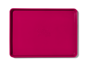 Great Jones | Holy Sheet - Pepper, a nonstick pink rectangular tray, ideal for easy clean-up and stylish table presentation, perfect for kitchen enthusiasts.