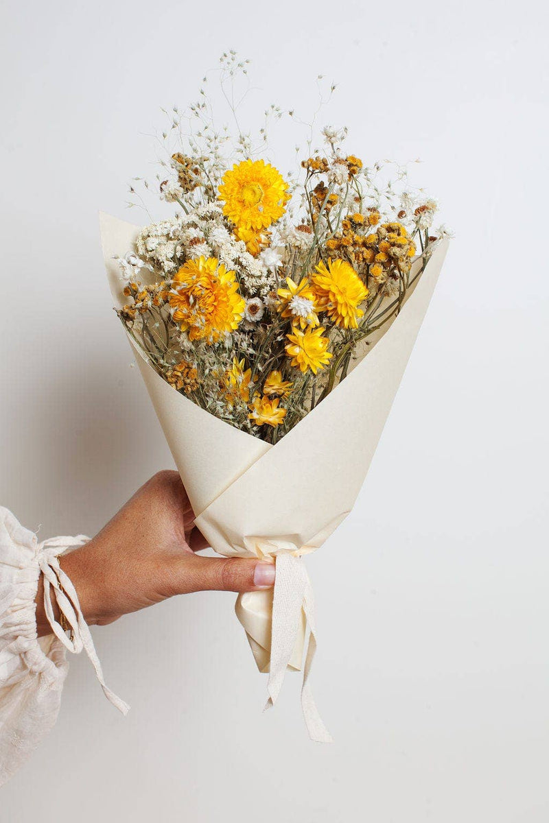 Idlewild Floral Co. - Sunshine Small Field Bouquet, elegantly wrapped with bright yellow and white dried flowers, perfect for adding cheer to spring occasions.