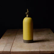 Rose Line Pottery - Oil Bottle - Yellow - 22 Ounces, handcrafted stoneware with a brass nozzle, ideal for olive oil or syrup, on a rustic wooden table.