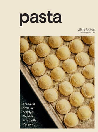 Cookbook cover Pasta by Misya Robbins and Talia Baiocchi, displaying freshly made ravioli on a tray, highlighting Italian culinary art and recipes.