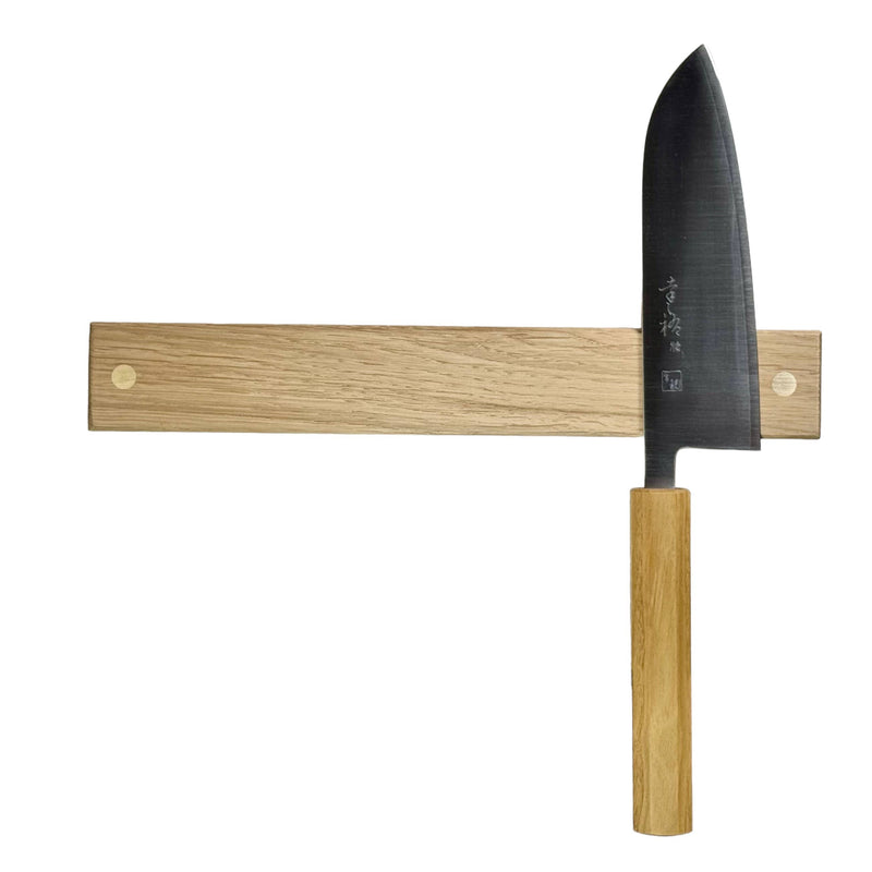 Close-up of Rune-Jakobsen Design '2-DOTS' Knife Holder with Brass Details, showcasing the handmade oak magnetic rail for knives, emphasizing craftsmanship and functionality.