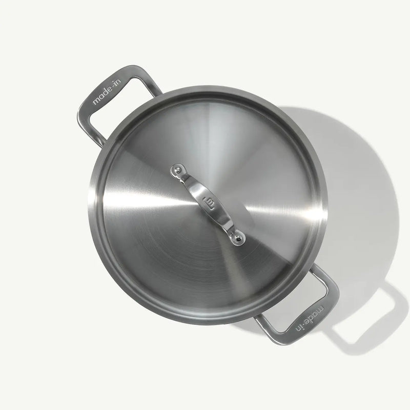 Made In | 8QT Stainless Steel Stock Pot with Lid, featuring loop handles and durable 5-ply construction for even heat distribution and easy handling.