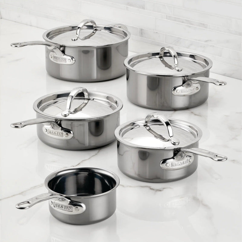 Hestan | Cookware, .75qt Butter Warmer Pan, featuring polished stainless steel with ergonomic handles, perfect for melting butter or sauces, displayed on a marble countertop.