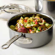 Hestan NanoBond saucepan with lid, showcasing potato salad. Lightweight, titanium-enhanced, durable design ideal for efficient heating and precision pouring, aligning with Athens Cooks' curated cookware collection.