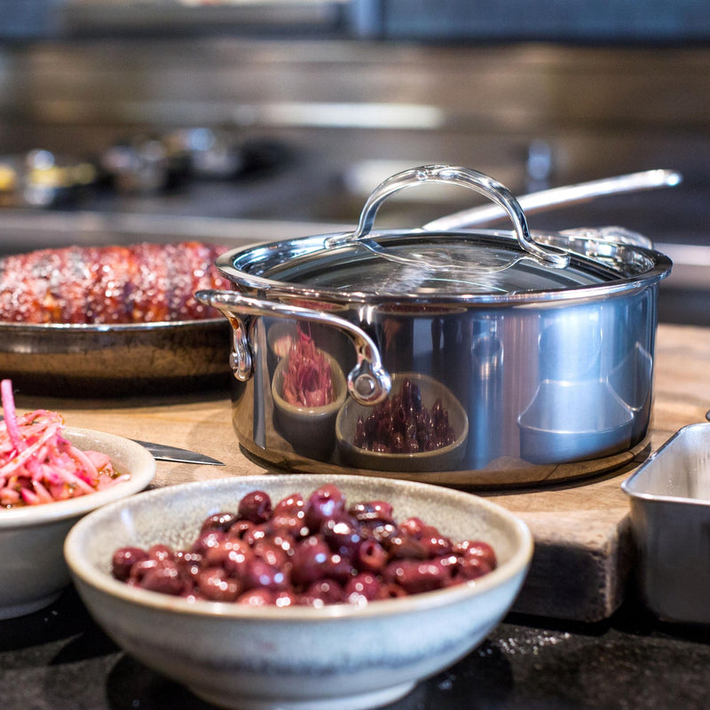 Hestan NanoBond Cookware, 3qt Soup Pot showcased in a kitchen-prep scene with olives and pickled onions, highlighting its stainless-steel construction and durable design.