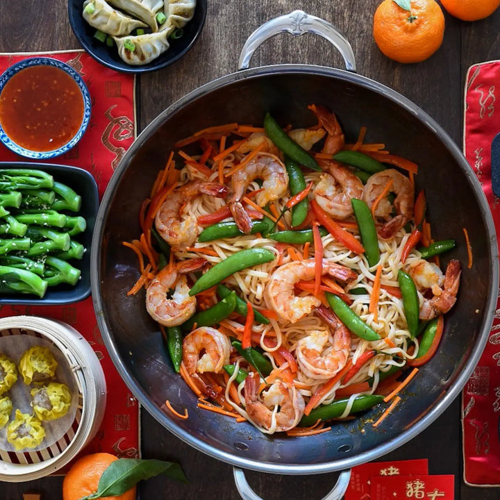 Hestan | Nanobond 14 Wok showcasing stir-fried shrimp and vegetables, ideal for gourmet seafood dishes, available at Athens Cooks kitchen store.