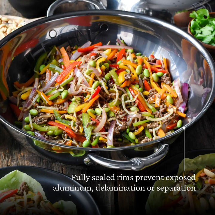 Hestan | Nanobond 14 Wok featuring a vibrant vegetable stir-fry, showcasing its cooking efficiency and versatility, ideal for culinary enthusiasts.