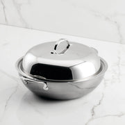 Hestan NanoBond 14 Wok with domed lid on marble, showcasing ergonomic handle and titanium-strengthened stainless steel for high-heat cooking, perfect for Athens Cooks' curated kitchen collection.