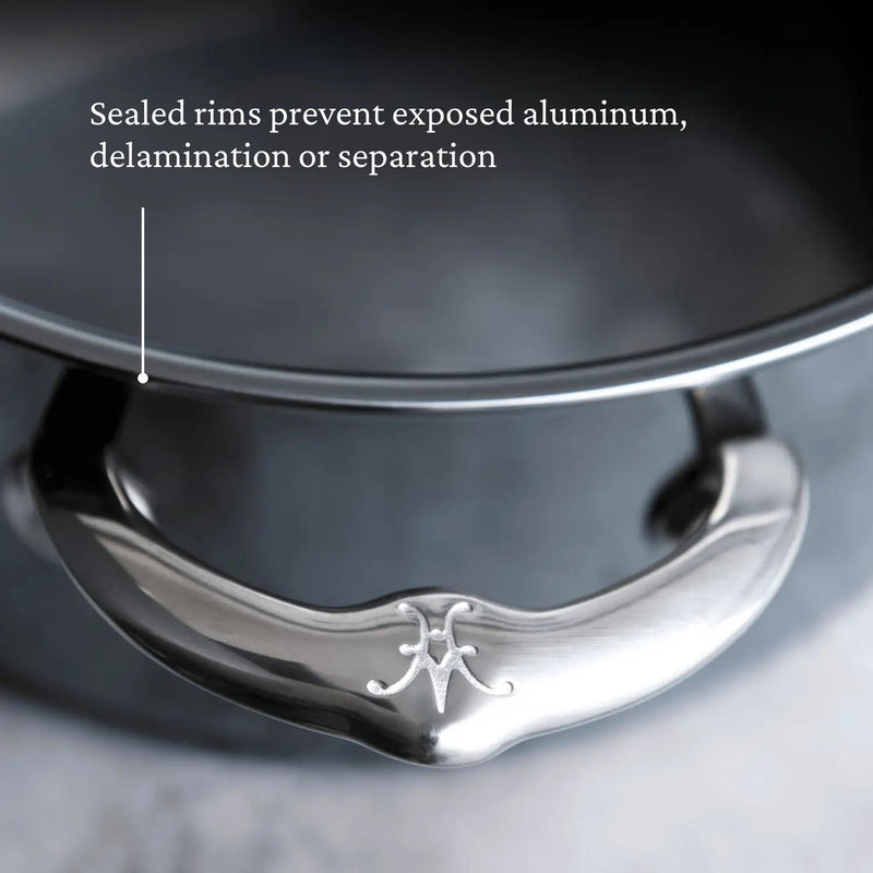 Hestan | Titanium Essential 5-Piece Cookware Set lid with polished handle and sealed rim, showcasing durable construction and innovative Molecular Titanium technology.